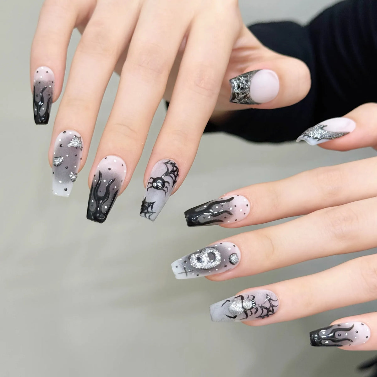 Silver Smoke medium coffin press-on nails worn on hands with smoky gradients, silver glitter and spider webs