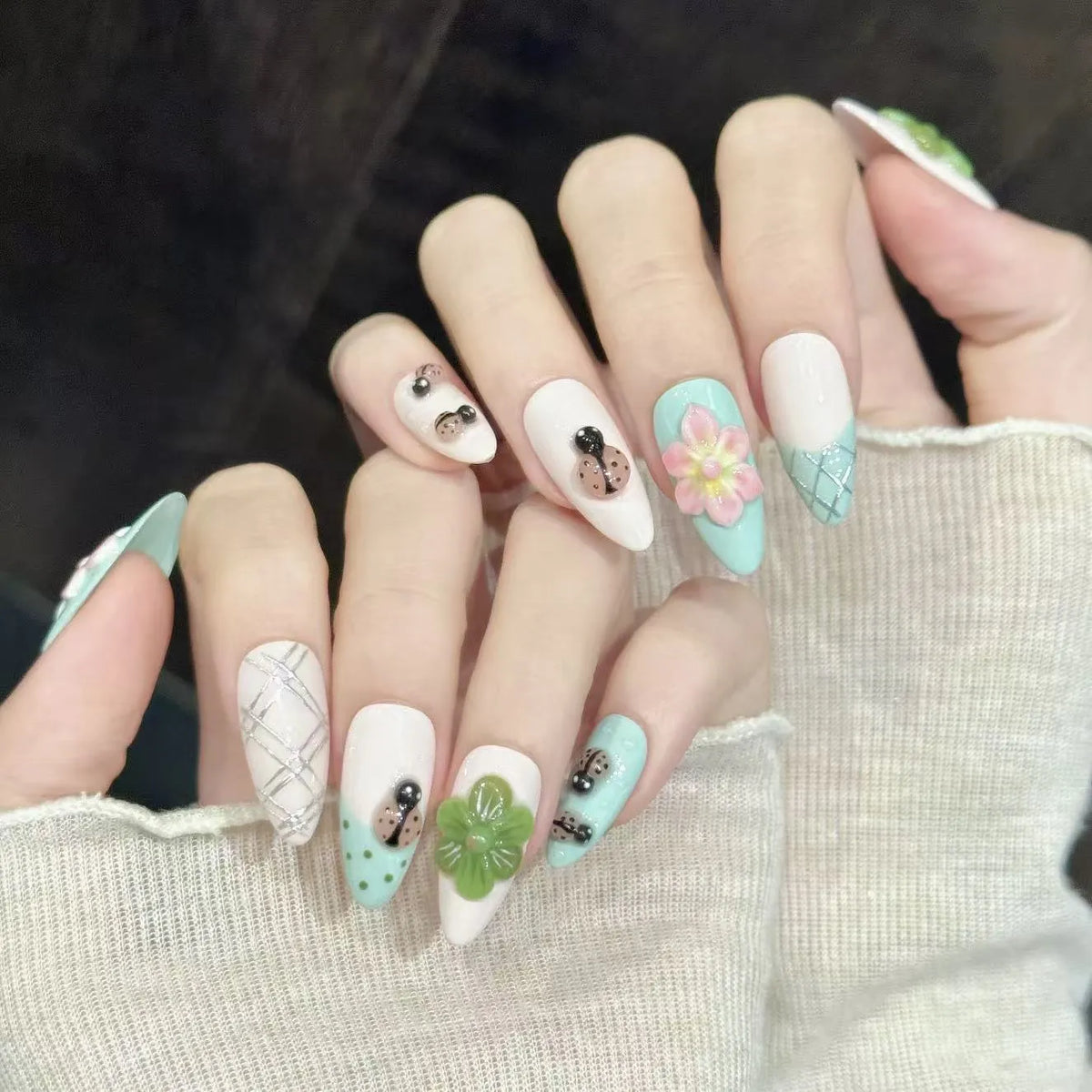 Summer Flower almond nails angled view showing fresh nature-inspired floral design 🌸