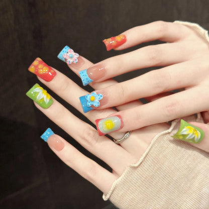Sweet Fruit Garden almond nails angled view showing colorful fruit elements and 3D floral art
