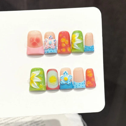 Sweet Fruit Garden short almond press-on nails with 3D fruit and flower design on hand - lifestyle shot