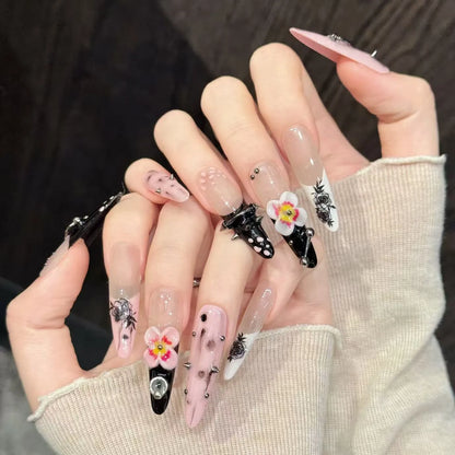 Thorn Mystery stiletto nails angled view showing gothic punk design and metal hardware details ⛓️