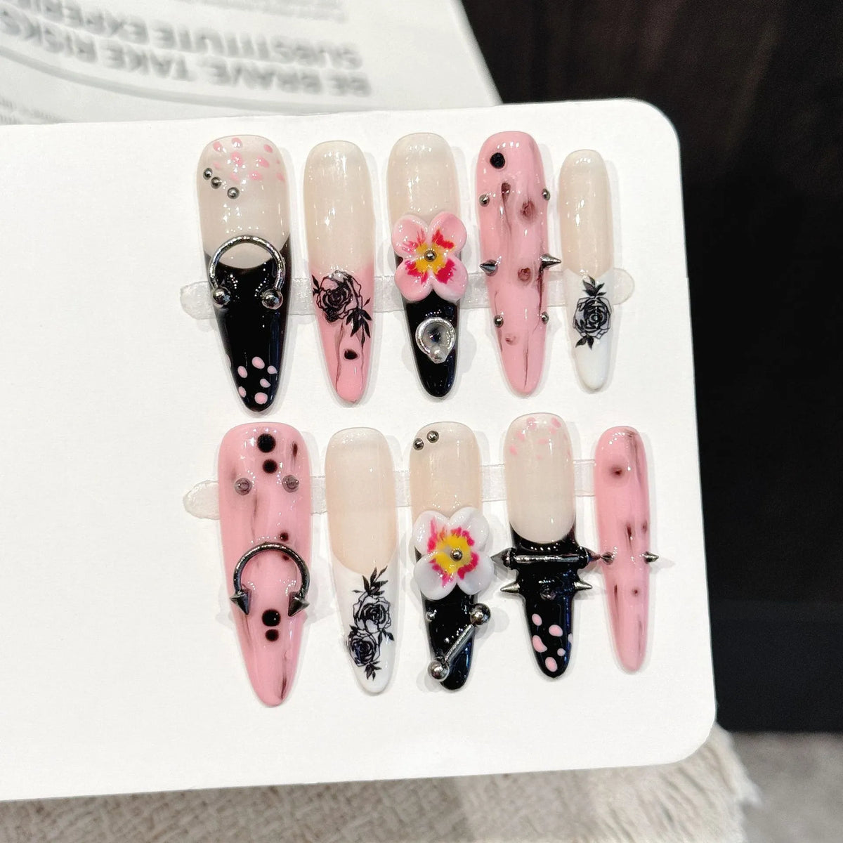 Thorn Mystery long stiletto press-on nails with gothic studs chains 3D rose edgy design on hand - lifestyle shot 🥀⛓️