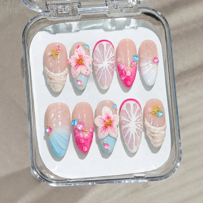 Tropical Shell Blossom handmade Medium Almond nail set arranged in a clear presentation case
