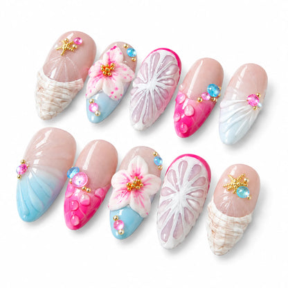 Detailed view of NM-C157 Medium Almond nails with citrus linework colorful crystals and bubble accents