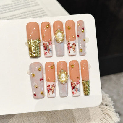 Van Gogh Angel long square press-on nails with vintage oil painting, gold leaf, and pearl luxury design on hand - lifestyle shot 🎨👼