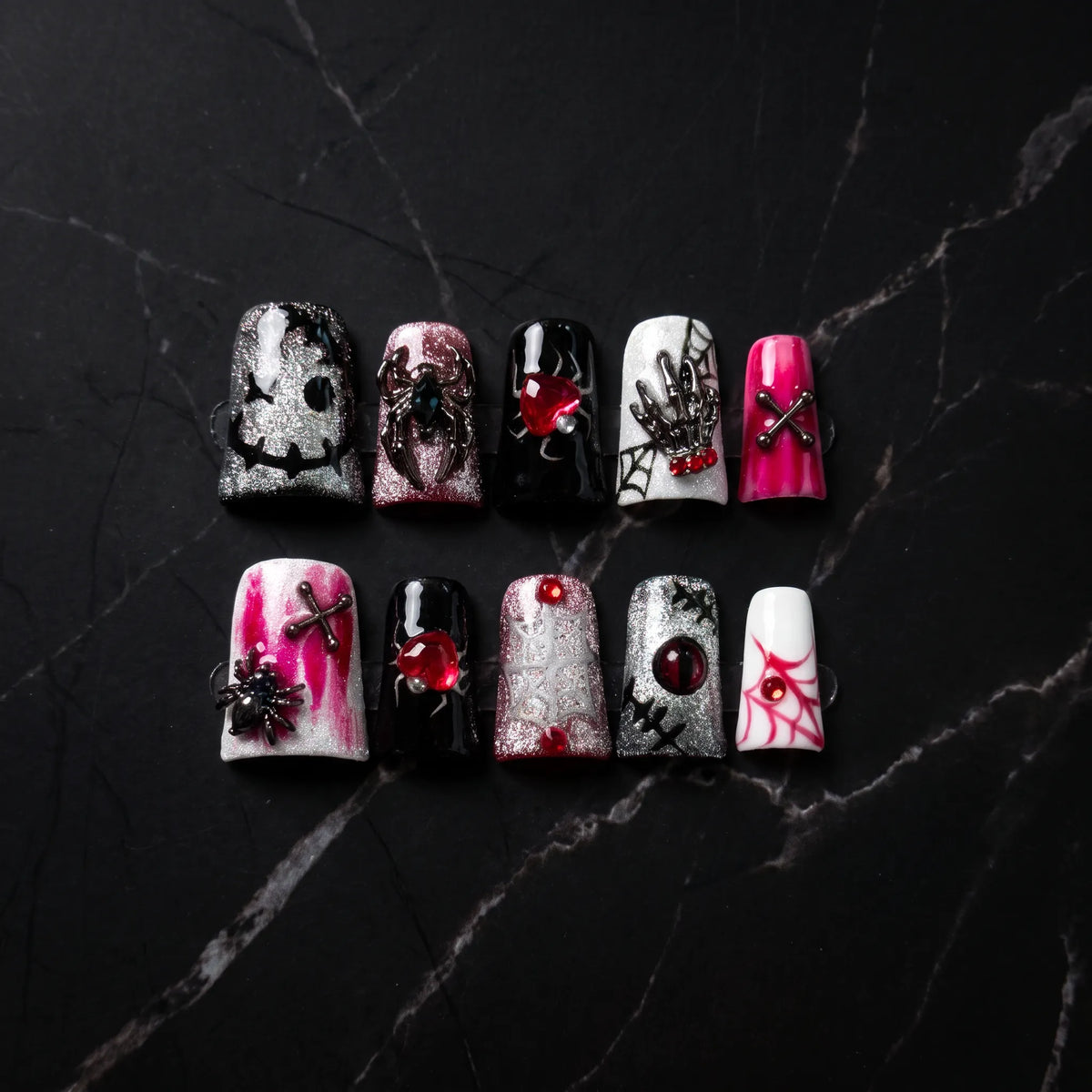 Web of Hearts 10-piece handmade press-on nail set with spider web and rose designs - product flat lay