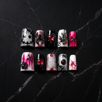 Web of Hearts 10-piece handmade press-on nail set with spider web and rose designs - product flat lay